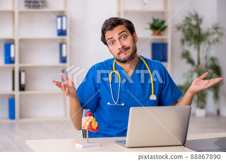 Young male doctor working in the clinic Young male doctor working in the clinic 88867890