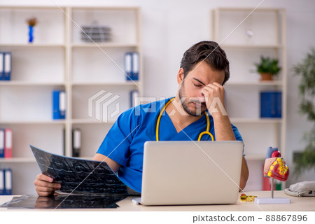 Young male doctor radiologist working in the clinic Young male doctor radiologist working in the clinic 88867896