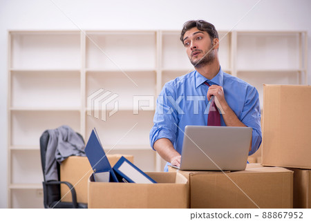 Young male employee in office relocation concept 88867952