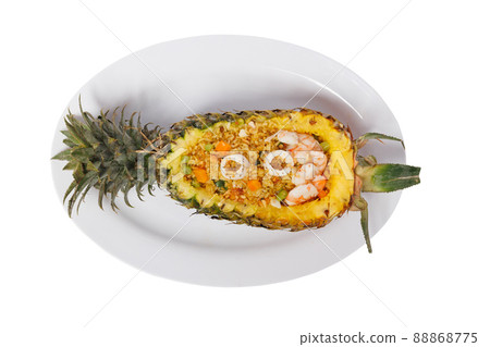 Thai style seafood fried rice, placed in pineapple 88868775