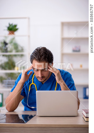 Young male doctor working in the clinic 88868797