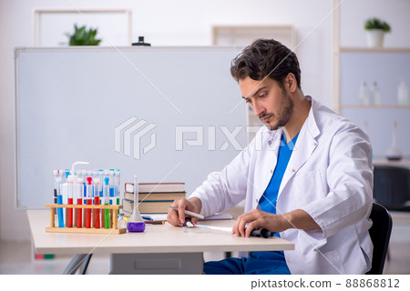 Young male chemist working at the lab Young male chemist working at the lab 88868812