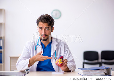 Young male doctor cardiologist working in the clinic 88868829