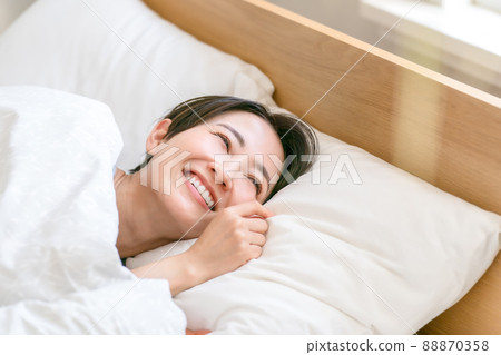 Sleep awakening morning woman smile 88870358