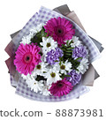 Bouquet of gerbera, daisies and carnations in a package on a white background 88873981