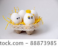 Eggs in a stand on a beige background 88873985
