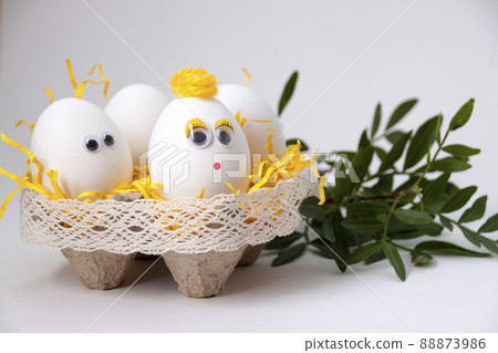 Eggs in a stand on a beige background 88873986