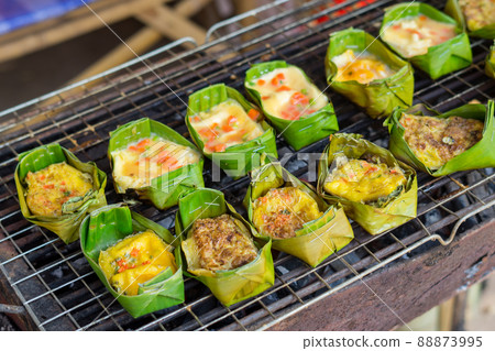 Grilling eggs with banana leaves Grilling eggs with banana leaves 88873995