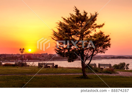 Sunset sky, houses, lanterns Nesebar, Bulgaria 88874287