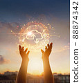 Cloud computing and networking concept. Hands touching global network and cloud icon on sunset background. 88874342