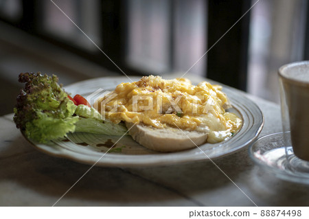 Scrambled eggs on toast. Scrambled eggs on toast. 88874498