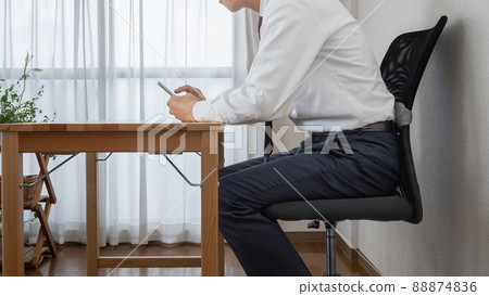 Kyphosis / smartphone neck ｜ Businessman with bad posture 88874836