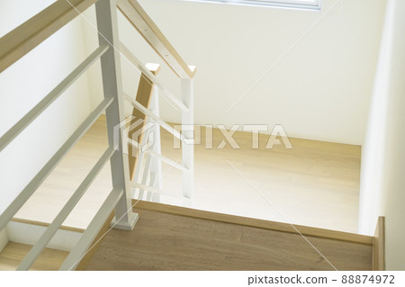 Modern design white wooden stairs. Stairs and a wooden banister and railing, close-up. 88874972