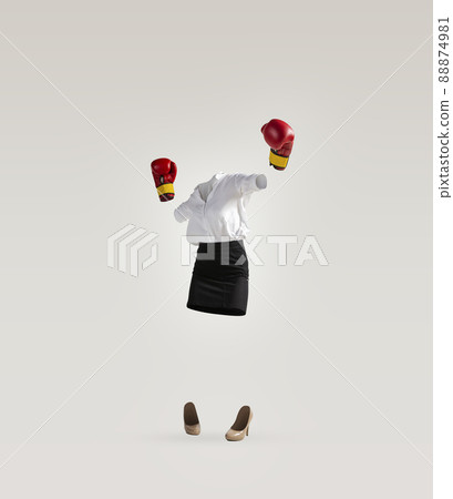 Contemporary art collage of invisible woman wearing modern business style outfit and boxing gloves on white background. Concept of fashion, style Contemporary art collage of invisible woman wearing modern business style outfit and boxing gloves on white background. Concept of fashion, style 88874981