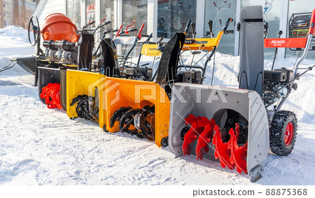 Kemerovo, Russia, February 17, 2022. A new petrol snowplow is on sale. Snow removal mechanism. A device for snow removal at home in winter. 88875368
