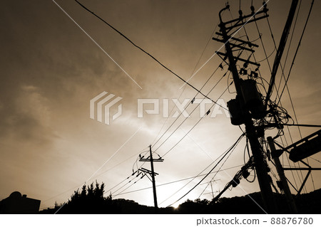 Evening sunset and telephone pole cables 88876780