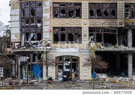 Irpin, Kyev region Ukraine - 09.04.2022: Cities of Ukraine after the Russian occupation. Destroyed buildings on the streets of Irpen. Broken, shelled windows. Buildings after being hit by missiles. Irpin, Kyev region Ukraine - 09.04.2022: Cities of Ukraine after the Russian occupation. Destroyed buildings on the streets of Irpen. Broken, shelled windows. Buildings after being hit by missiles. 88877609