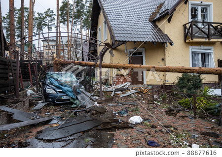 Irpin, Kyev region  Ukraine - 09.04.2022: Cities of Ukraine after the Russian occupation. House and yard destroyed by Russian missiles, mines, shells. Irpin, Bucha, Gostomel. 88877616