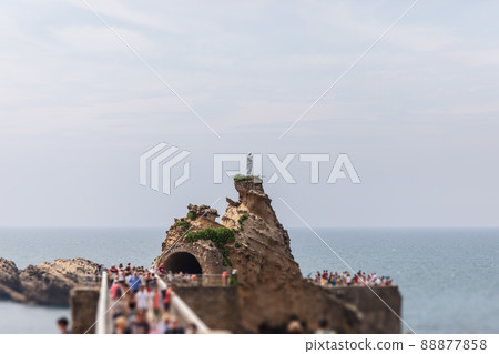 Local landmark cliff with statue of Virgin Mary on top and beautiful view of endless sea. Biarritz 88877858