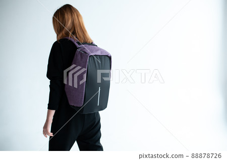 stylish hipster person holding modern backpack bag on white background 88878726