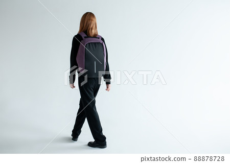 stylish hipster person holding modern backpack bag on white background 88878728