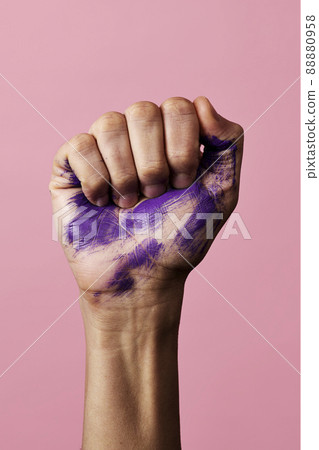 clenched fist with stains of purple paint clenched fist with stains of purple paint 88880958
