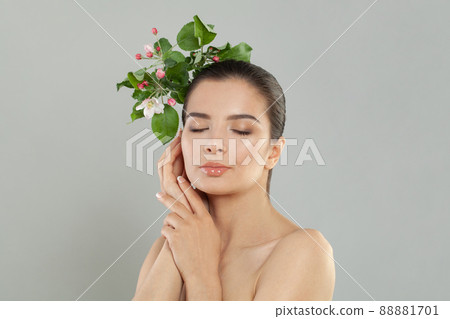 Young beautiful woman relaxing at spa on grey background, professional beauty makeup 88881701