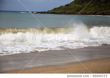 Waves rushing to the sandy beach Waves rushing to the sandy beach 88884153