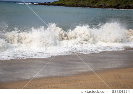 Waves rushing to the sandy beach Waves rushing to the sandy beach 88884154
