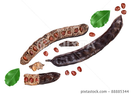 Carob pod and powder isolated on white background with clipping path and full depth of field. Top view. Flat lay 88885344