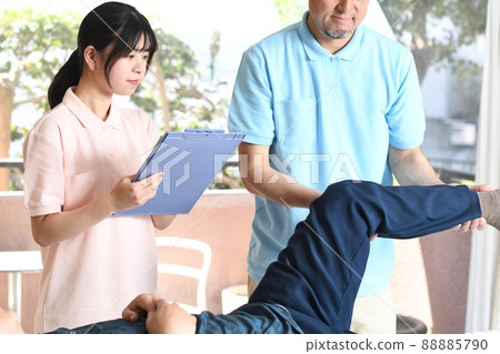 Female and male chiropractors undergoing chiropractor training 88885790