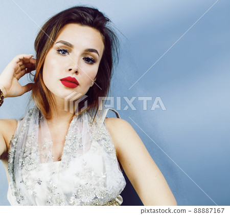 young pretty woman with blond hair on blue background, sensual make up elegant look young pretty woman with blond hair on blue background, sensual make up elegant look 88887167