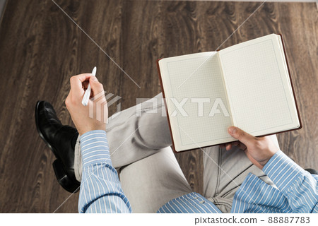 businessman with notepad, works in the office 88887783