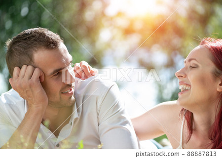 Couple with a dog in the park 88887813