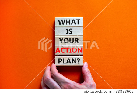 Action plan symbol. Concept words What is your action plan on wooden blocks. Businessman hand. Beautiful orange table orange background. Business What is your action plan concept. Copy space. 88888603
