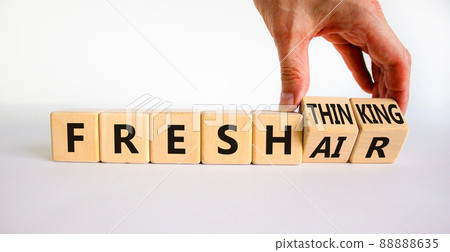 Fresh thinking and air symbol. Businessman turns wooden cubes, changes words fresh thinking to fresh air. Beautiful white background. Copy space. Business, ecological, fresh thinking and air concept. Fresh thinking and air symbol. Businessman turns wooden cubes, changes words fresh thinking to fresh air. Beautiful white background. Copy space. Business, ecological, fresh thinking and air concept. 88888635
