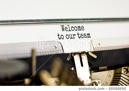 Welcome to our team symbol. Concept words Welcome to our team typed on retro typewriter. Beautiful white background. Business, motivational and welcome to our team concept. 88888698