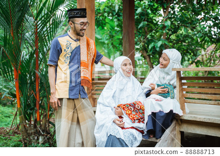 family muslim sitting in the garden and having a conversation family muslim sitting in the garden and having a conversation 88888713