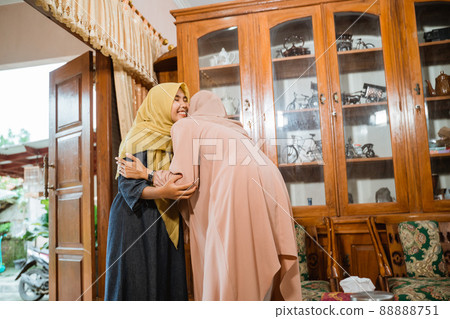 muslim woman hug and kissing each other during family visit 88888751