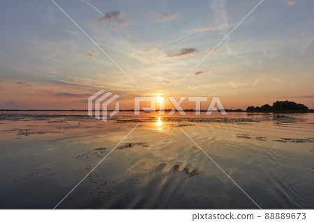 Sunset over a lake Sunset over a lake 88889673