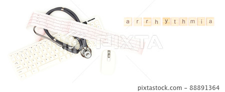 Arrhythmia. A stethoscope with an electrocardiogram sheet lying near a computer mouse and keyboard, isolated on a white background. Place to copy paste. 88891364