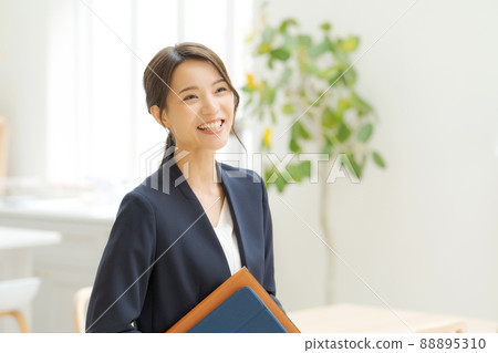 Working women's suit indoors 88895310