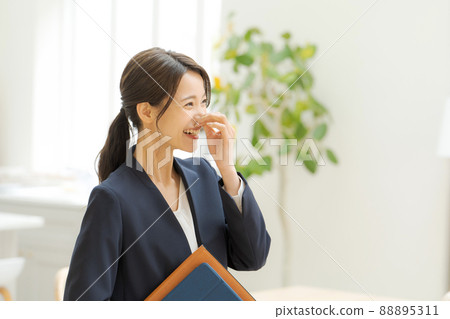 Working women's suit indoors 88895311