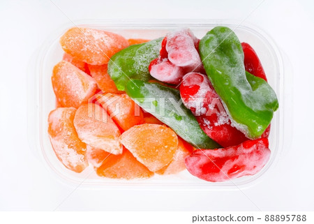 Frozen vegetables in a container, frozen carrots and peppers in a storage container Frozen vegetables in a container, frozen carrots and peppers in a storage container 88895788