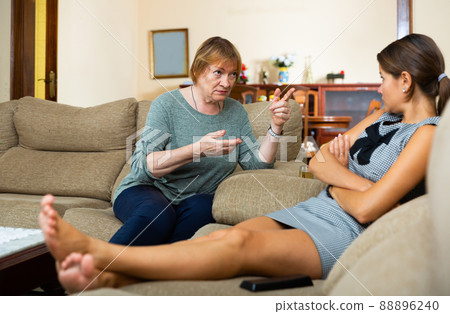 Mature mom scolds adult daughter in room at home Mature mom scolds adult daughter in room at home 88896240