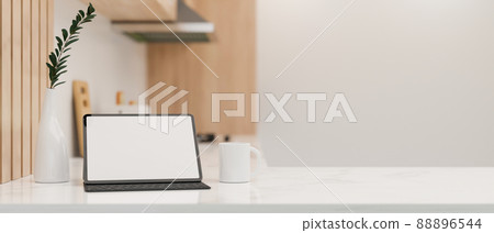 Minimal white kitchen countertop with copy space and a digital tablet mockup. Minimal white kitchen countertop with copy space and a digital tablet mockup. 88896544