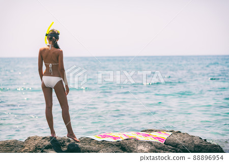 Beach vacation snorkel girl going swimming in ocean with snorkeling mask. Holiday lifestyle scene Beach vacation snorkel girl going swimming in ocean with snorkeling mask. Holiday lifestyle scene 88896954