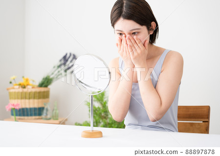 Beauty image of a young woman doing skin care Beauty image of a young woman doing skin care 88897878