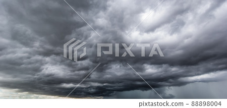 The dark sky with heavy clouds converging and a violent storm before the rain. The dark sky with heavy clouds converging and a violent storm before the rain. 88898004