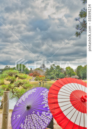 Japanese umbrella and Okayama castle 88899234